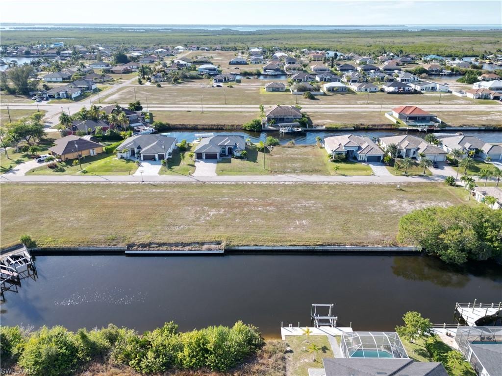 Aerial perspective of suburban area with a large body of water