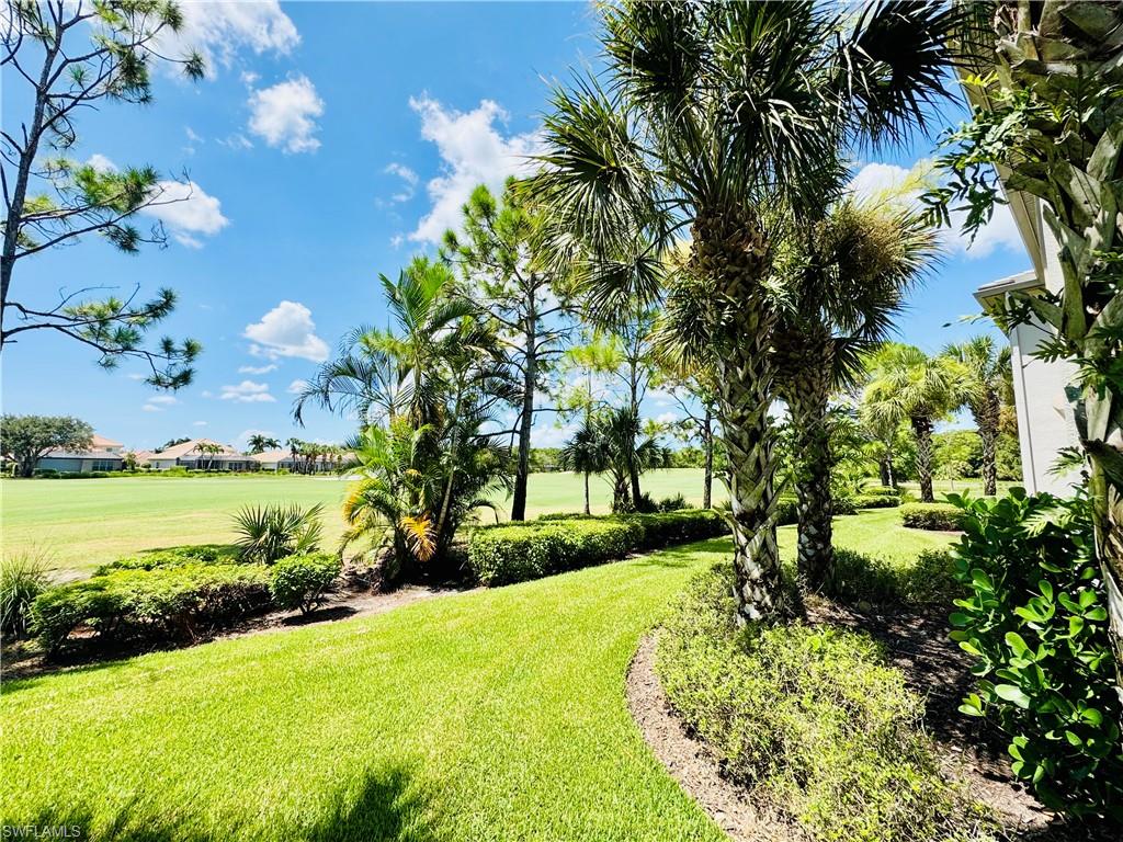 View of grassy yard with golf course view