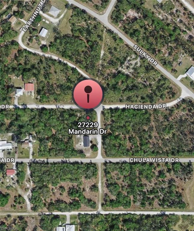 Aerial overview of property's location with property parcel outlined