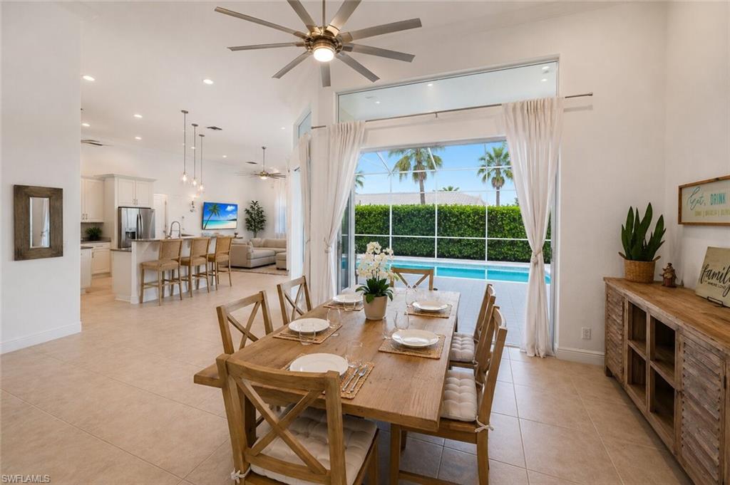 Dining area with direct access to a screened pool enclosure