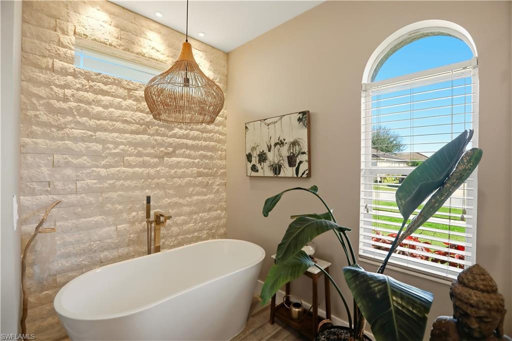 Full bathroom with a soaking tub