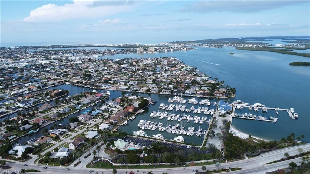 Aerial view of surrounding area featuring a nearby body of water