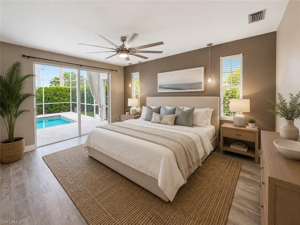 Room featuring sliding glass doors opening to a screened pool area