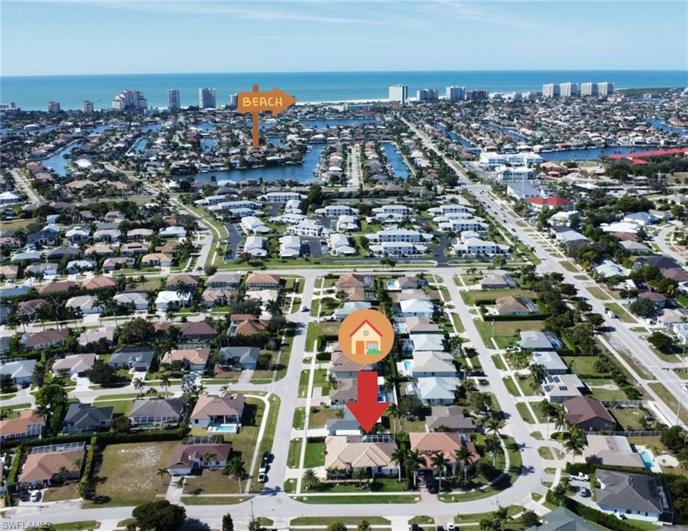 View of property location with a nearby body of water and nearby suburban area