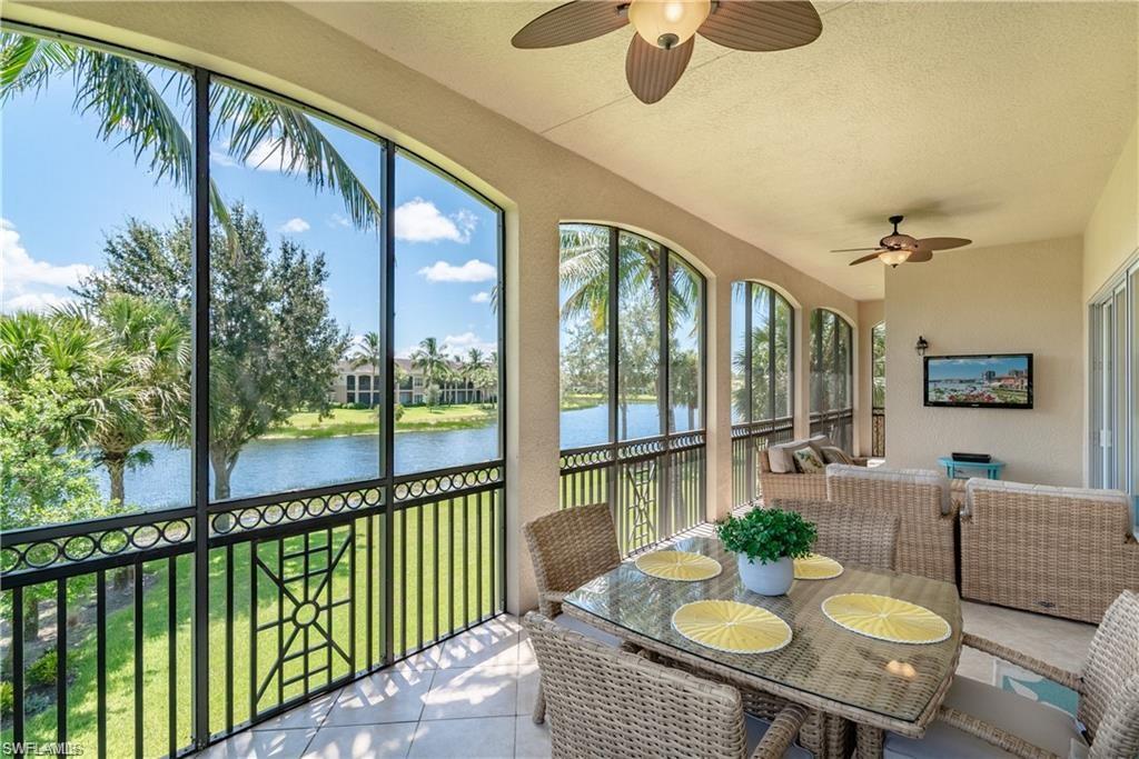 Sunroom featuring a ceiling fan and outdoor dining space
