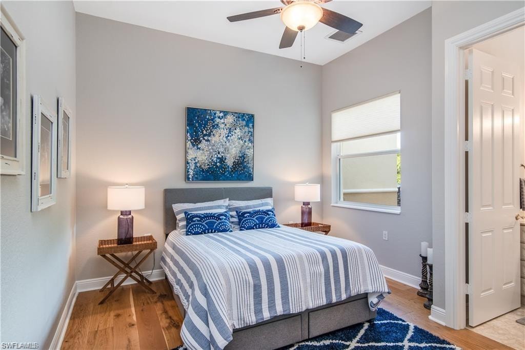 Bedroom with light wood-type flooring and ceiling fan