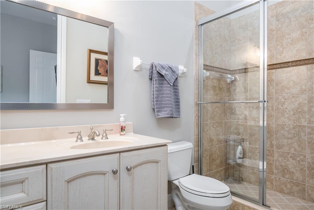 Bathroom with vanity and a shower stall
