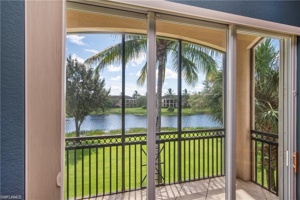 Unfurnished sunroom featuring a water view
