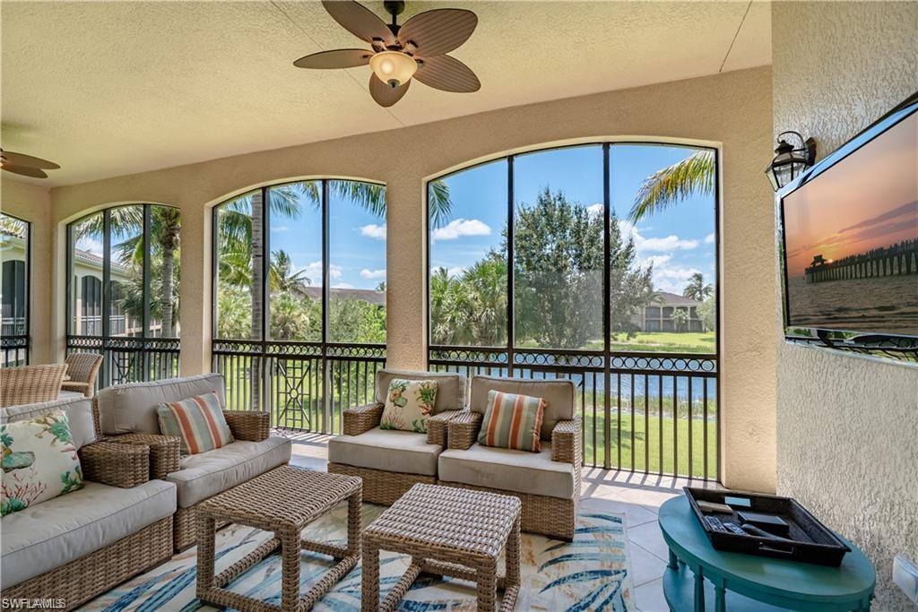 Sunroom with a ceiling fan and an outdoor living space
