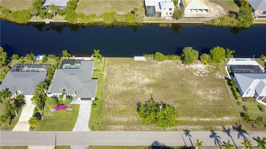 Aerial view of residential area featuring a large body of water