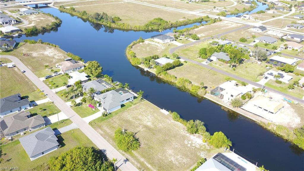 Aerial view of residential area with a nearby body of water