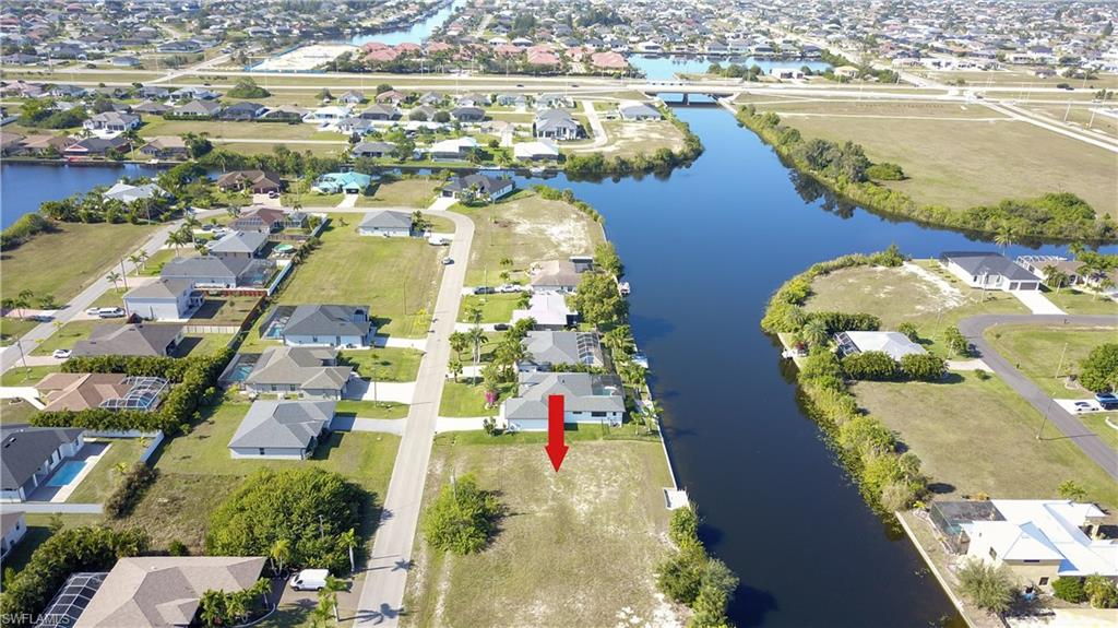 View of property location featuring nearby suburban area and a large body of water