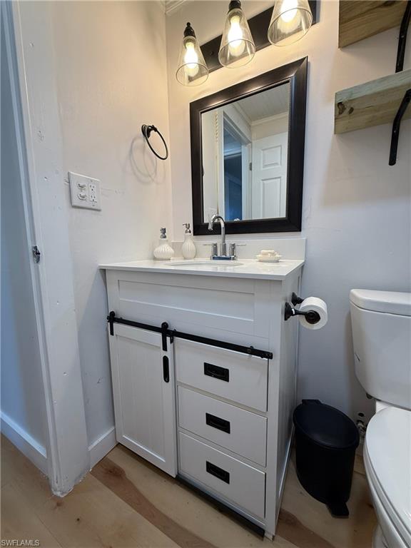 Bathroom with vanity and light wood finished floors