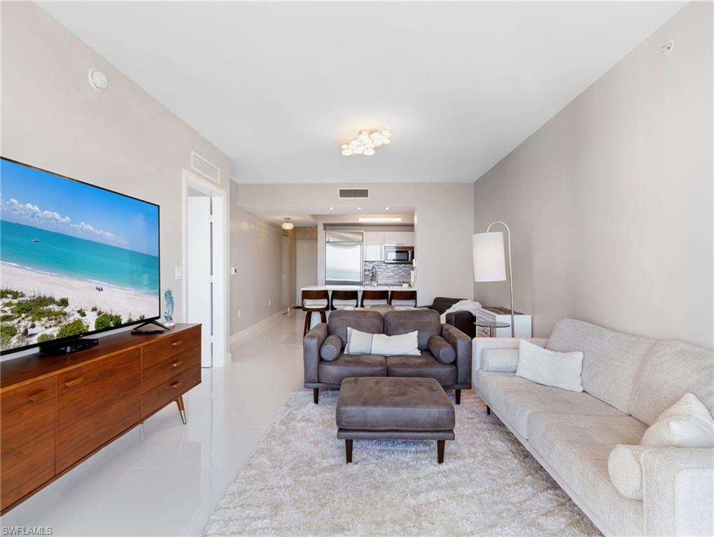 Living room toward kitchen and entry