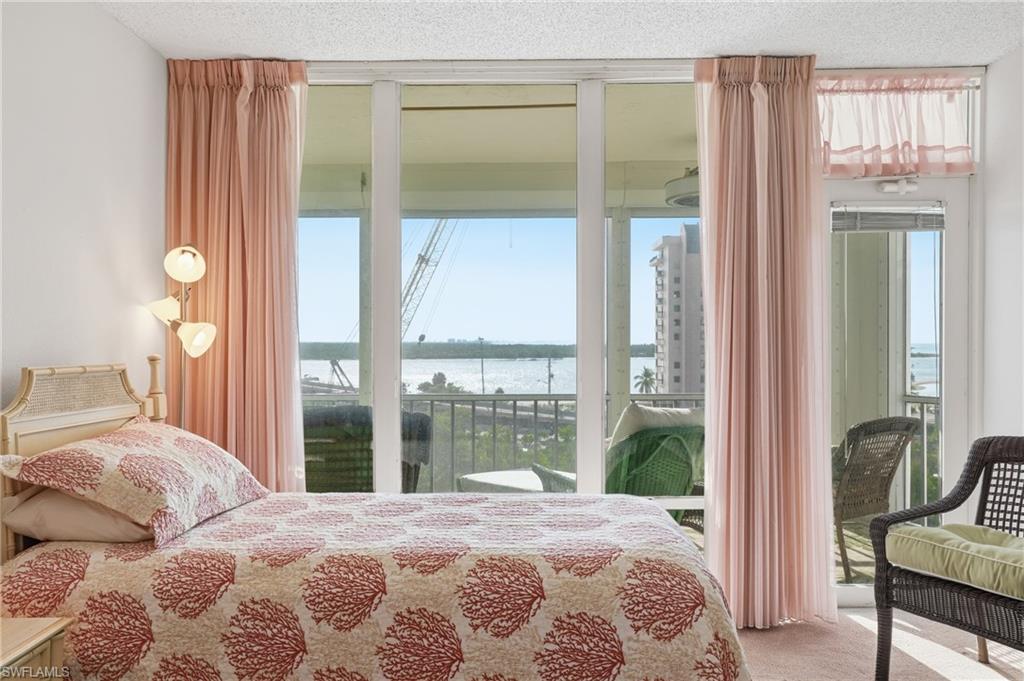 Bedroom #2 with a wall of windows to the lanai