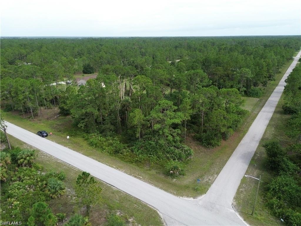 Aerial overview of property's location featuring a heavily wooded area
