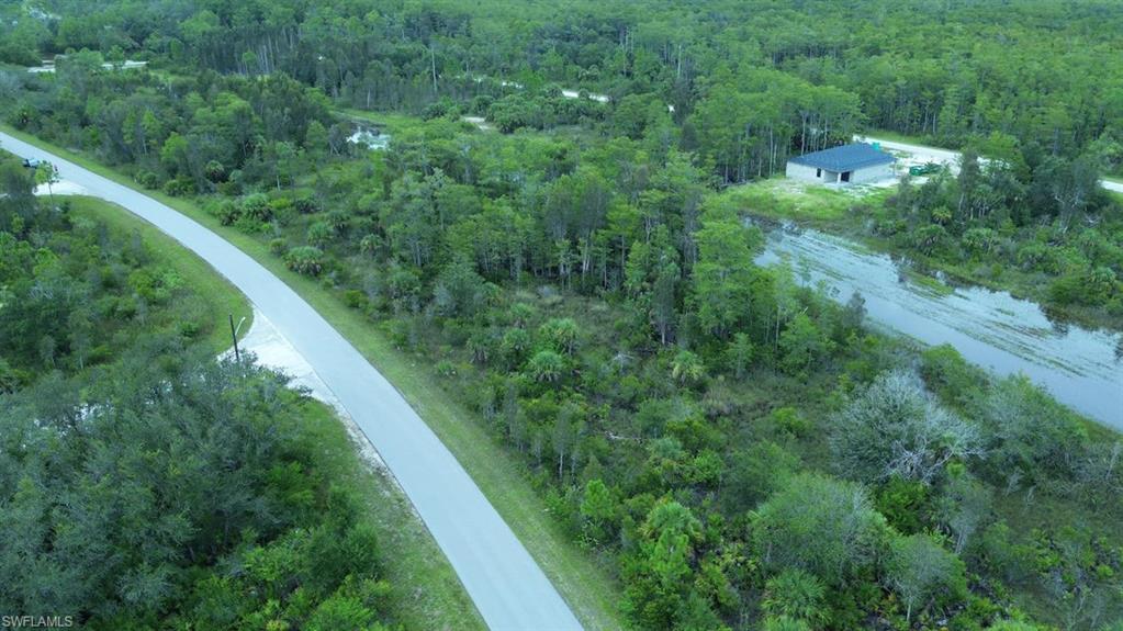 View of property location featuring a heavily wooded area