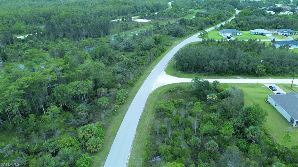 Aerial overview of property's location featuring a forest