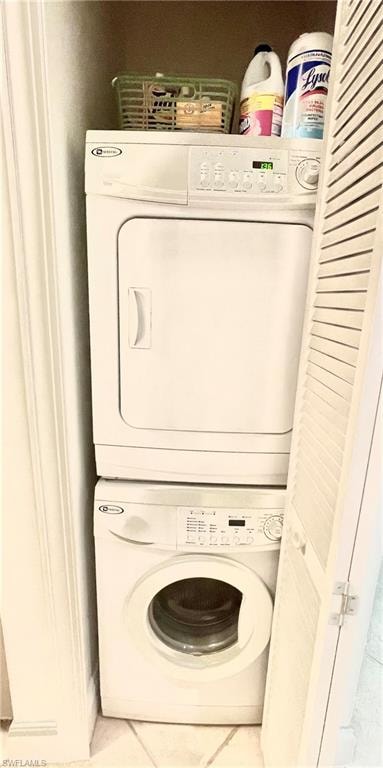 Laundry area featuring stacked washer / drying machine