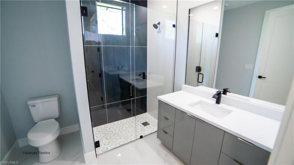 Bathroom with vanity and a shower stall