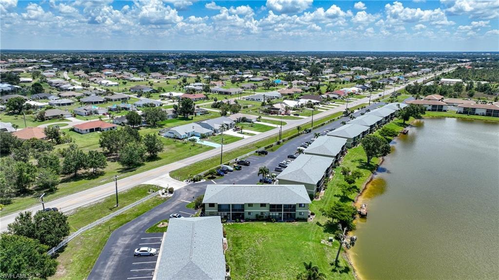 Aerial view of residential area with a large body of water