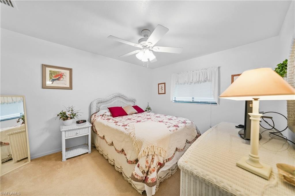 Bedroom featuring carpet and ceiling fan