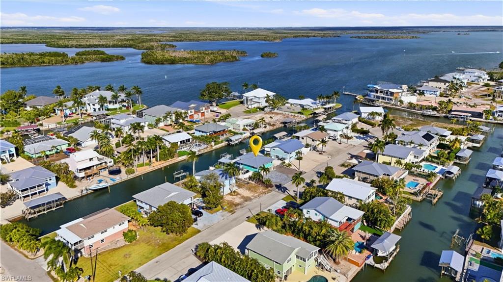Aerial perspective of suburban area with back bay - Virtually Edited Image