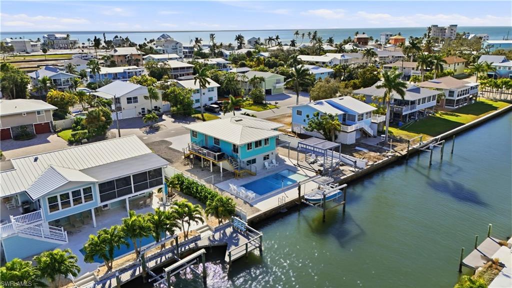 Aerial view of residential area with a nearby back bay- Virtually Edited Image