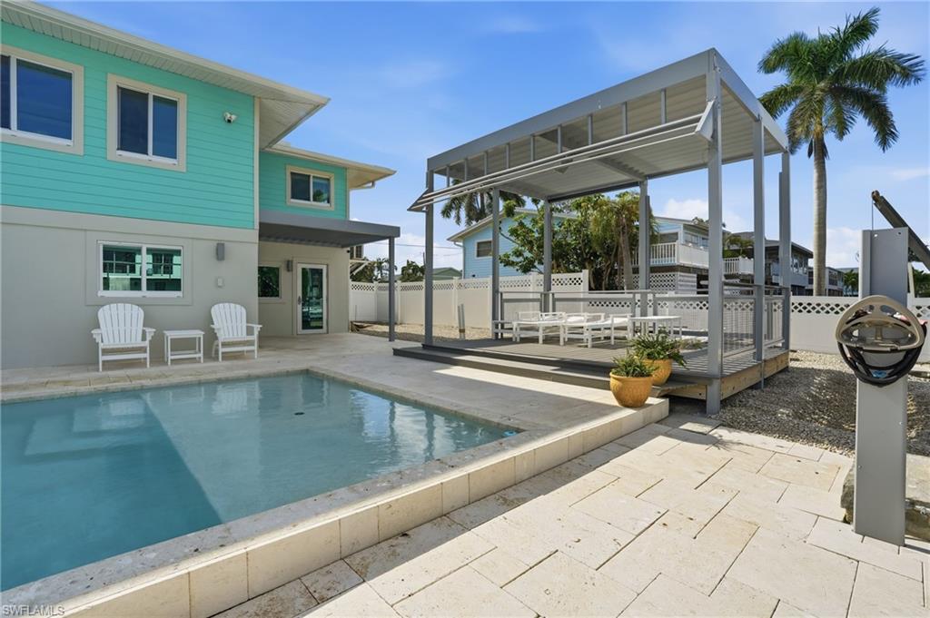 View of pool with a patio - Virtually Edited Image