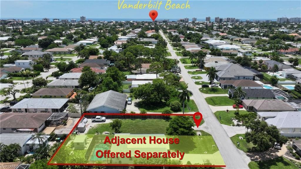Aerial perspective of a residential neighborhood featuring established homes and mature landscaping