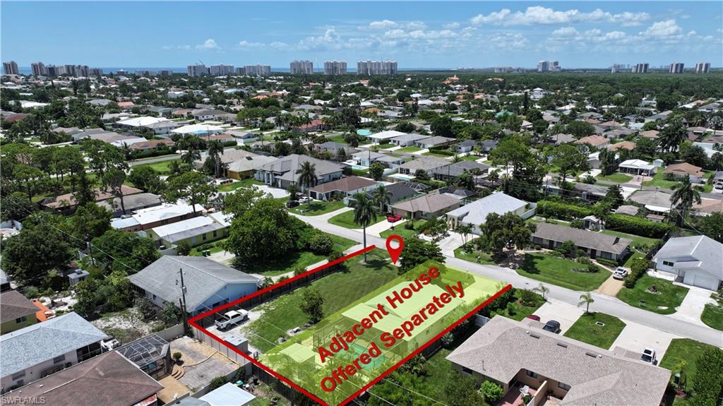 Expansive land parcel with clear boundaries, surrounded by established residential properties