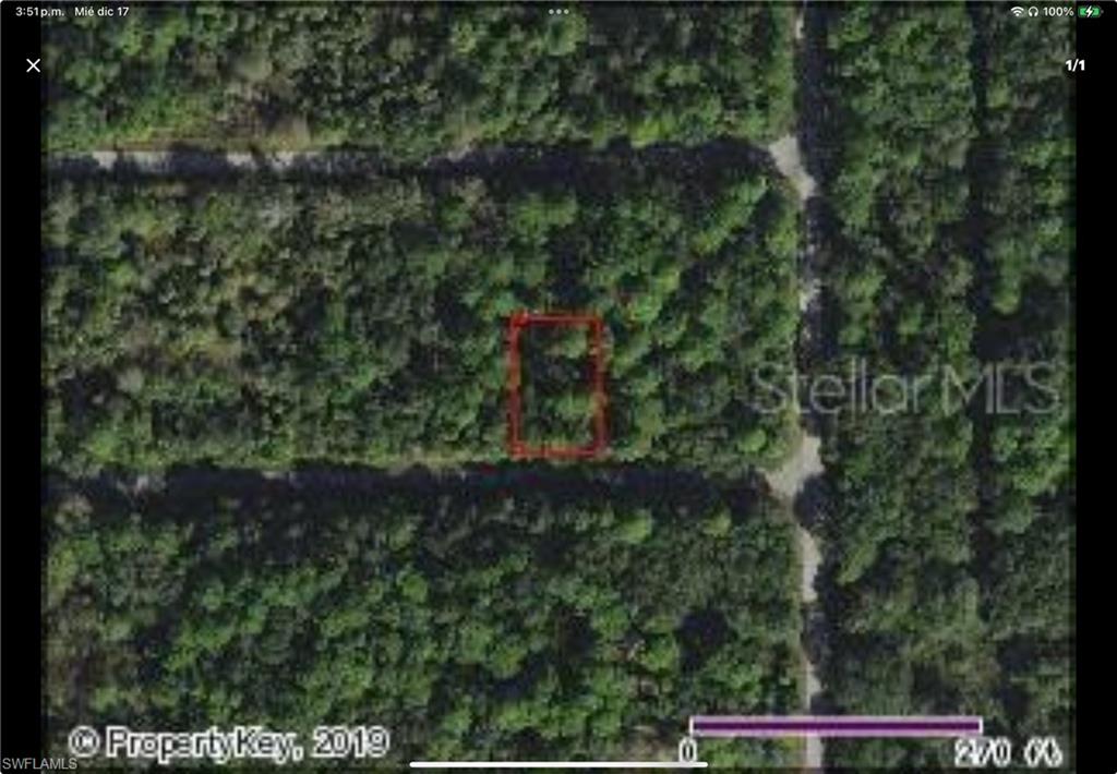 Aerial map of property and surrounding area featuring property parcel outlined