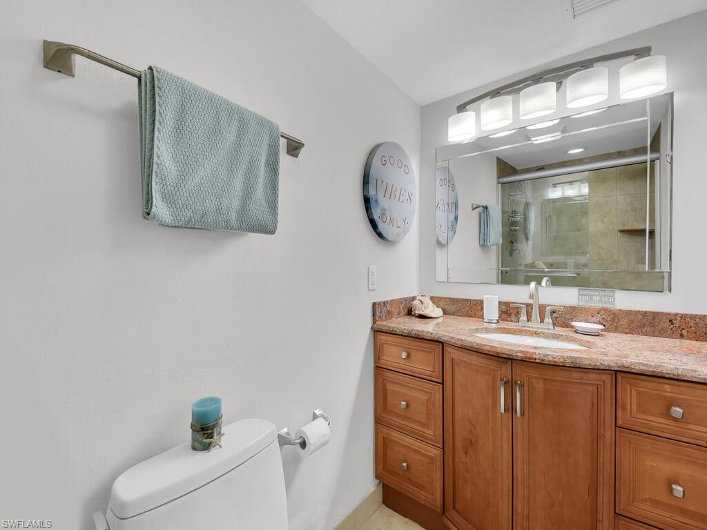 Bathroom featuring vanity and a stall shower