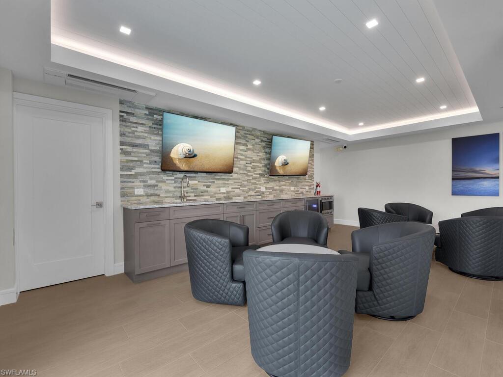 Common area with recessed lighting and a sink