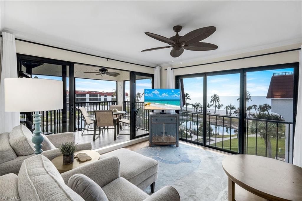 Living area with healthy amount of natural light and a ceiling fan