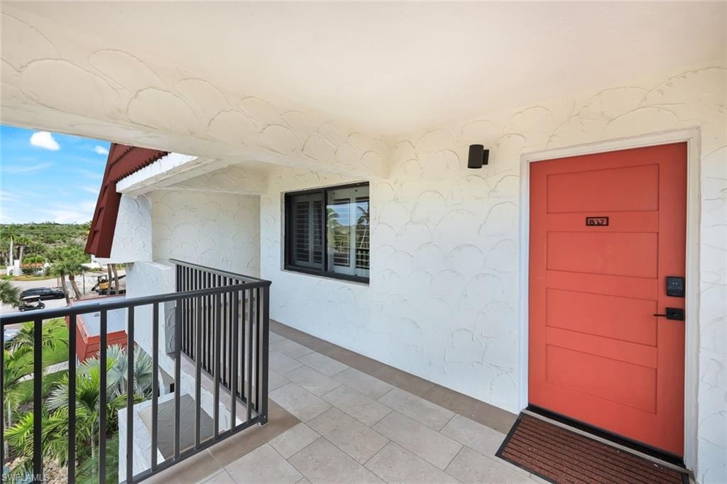 Entrance to property featuring stucco siding