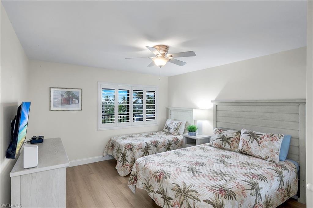 Bedroom featuring hardwood / wood-style flooring and a ceiling fan
