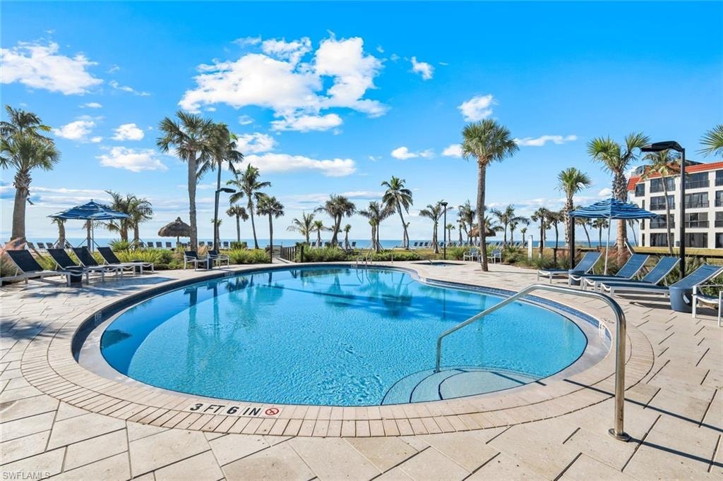 Community pool featuring a patio