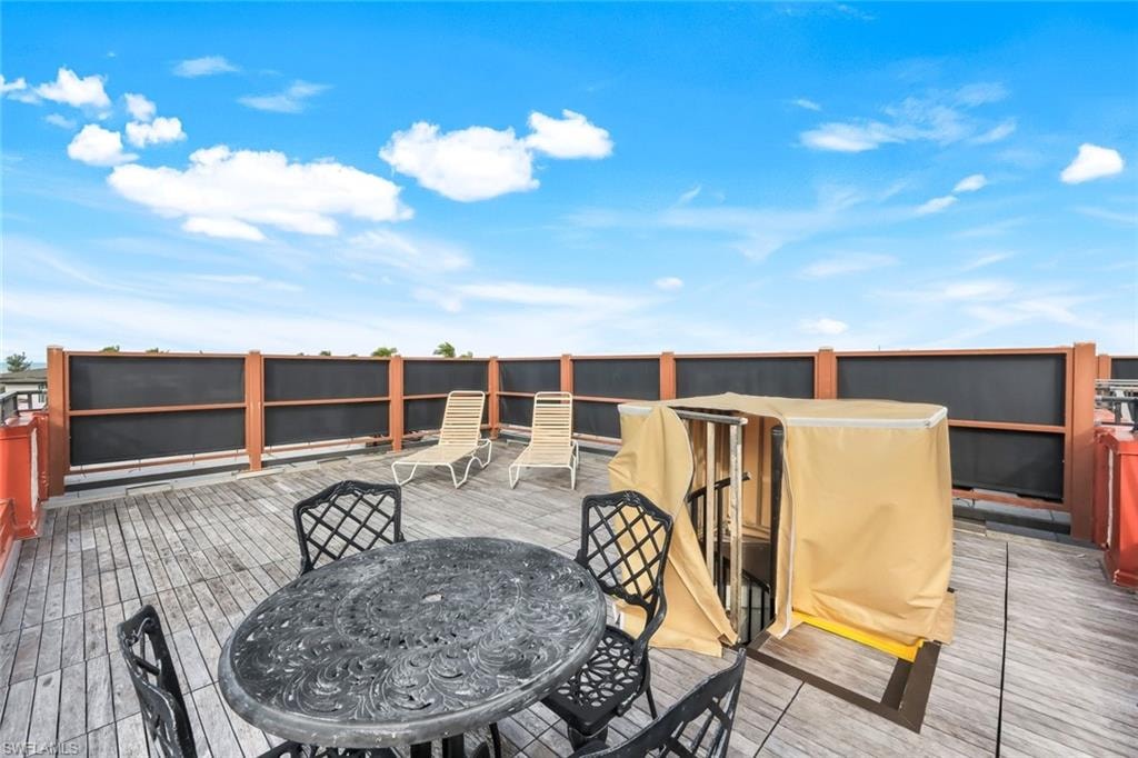 Wooden terrace with outdoor dining area