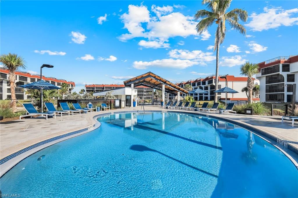 Community pool with a patio area