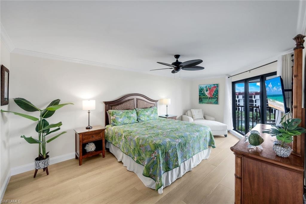 Bedroom featuring light wood-type flooring, access to outside, a ceiling fan, and crown molding