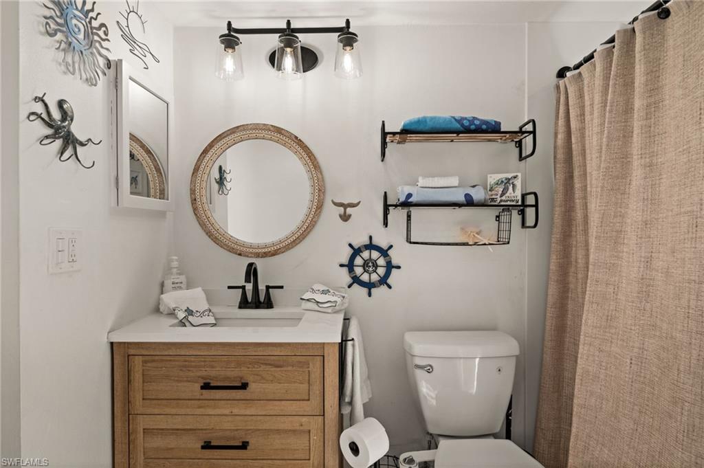 Bathroom featuring vanity and a shower with shower curtain