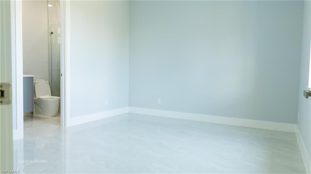 Spare room with baseboards
