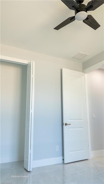 Unfurnished bedroom with baseboards and ceiling fan