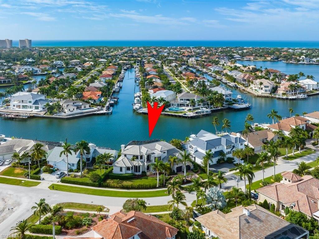 Aerial perspective of suburban area with a nearby body of water