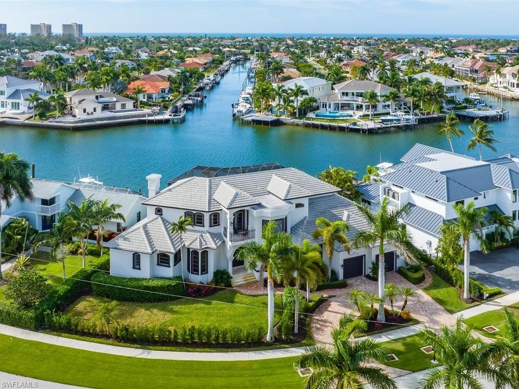 Aerial view of residential area with a large body of water