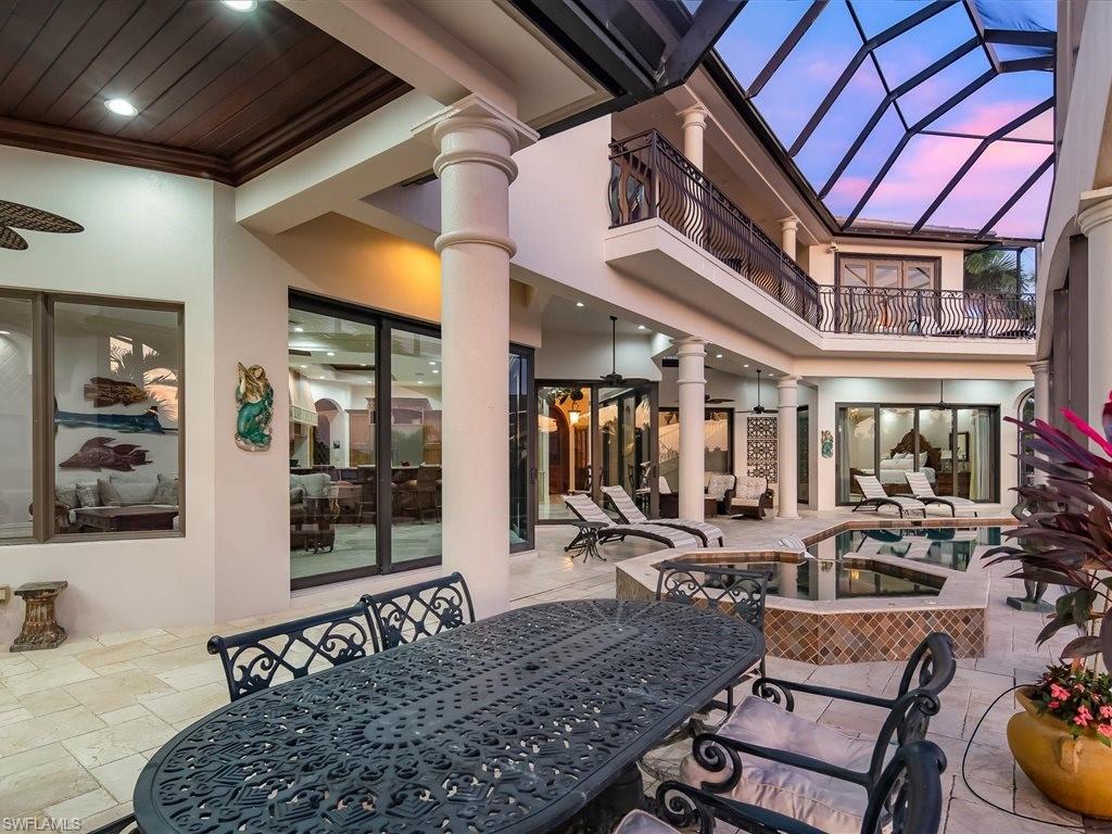 Patio / terrace featuring outdoor dining space, an outdoor pool, a patio area, and a ceiling fan