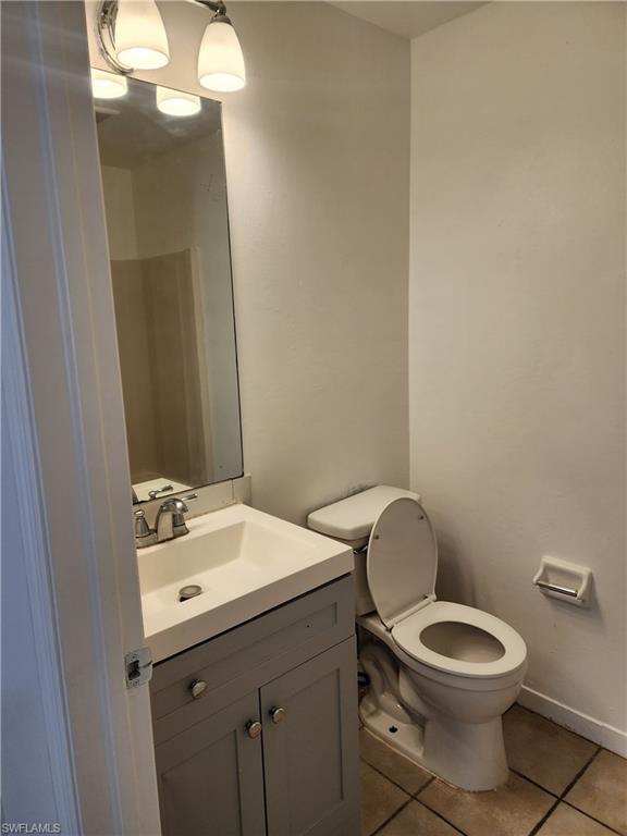 Bathroom with vanity and light tile patterned floors