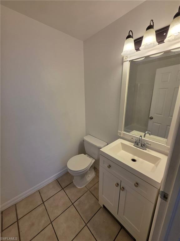 Bathroom with vanity and light tile patterned floors