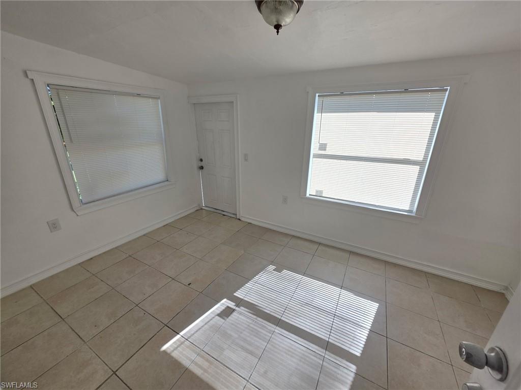 Entrance foyer featuring light tile patterned floors